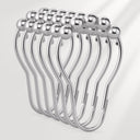 Set of silver curtain hooks on a white background