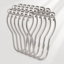 Set of silver curtain hooks on a white background