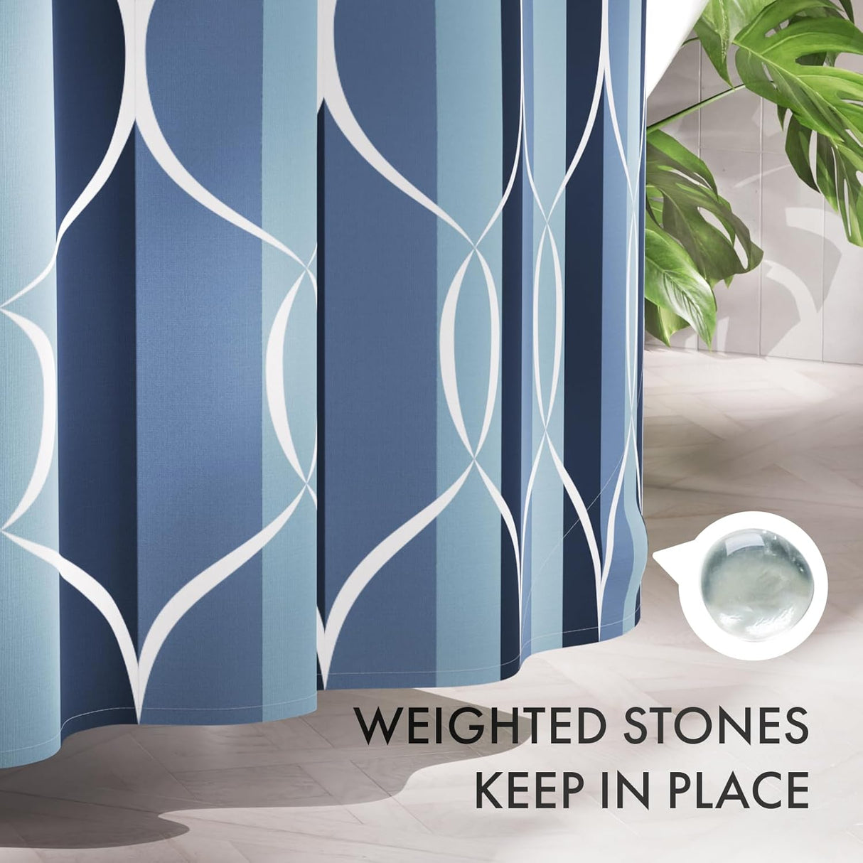 Blue and white patterned shower curtain with a small container of weighted stones on a bathroom floor.
