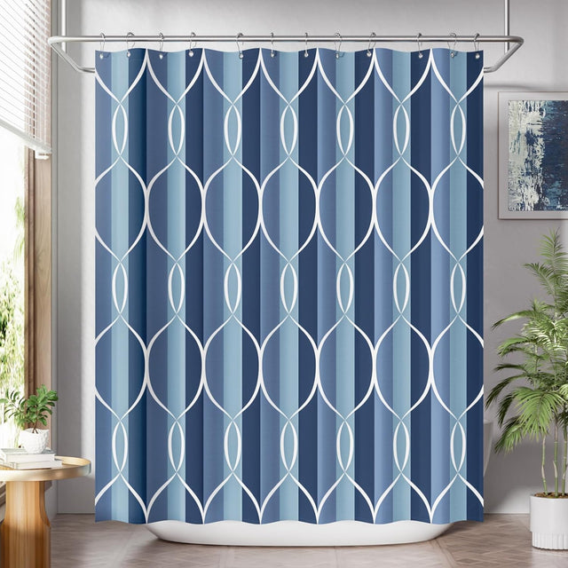 Shower curtain with geometric pattern in blue and white, hanging in a bathroom.