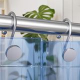 Metal shower curtain rod with clear shower curtain and plant in the background