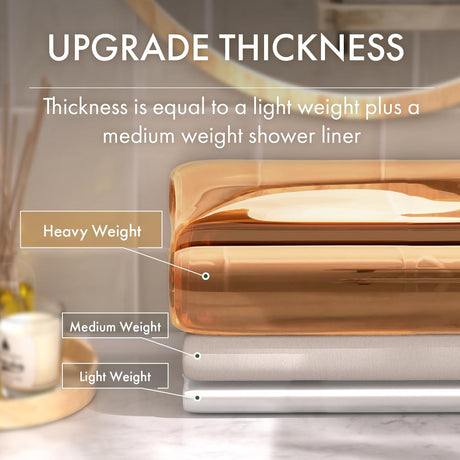 Stack of shower liners with labels for heavy, medium, and light weight on a blurred bathroom background.