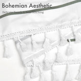 Close-up of white fabric with tassels and neat stitching, labeled 'Bohemian Aesthetic'.