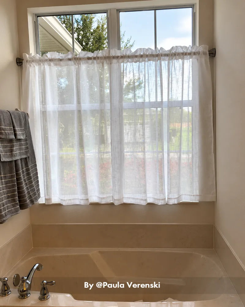 Customer bathroom photo showing a one-piece shower curtain rod installed above a tub, with the rod design clearly visible.