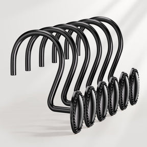 Set of black metal hooks with decorative elements on a white background