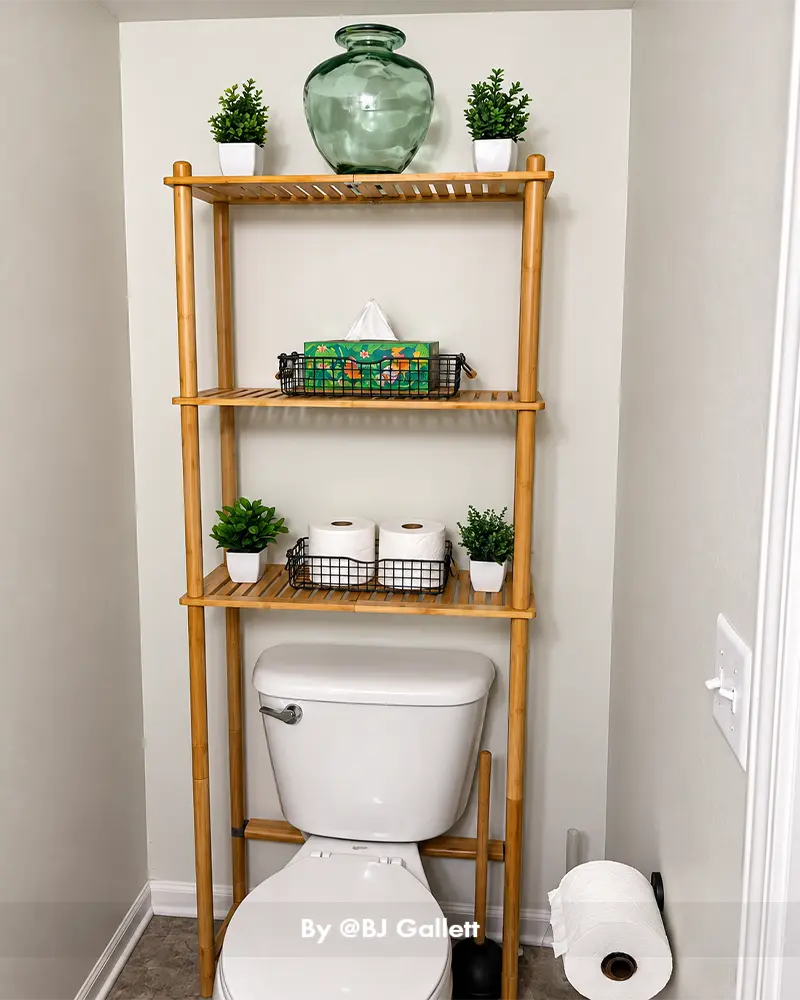 AmazerBath bamboo bathroom storage shelf positioned above a toilet, providing organized space for towels and toiletries