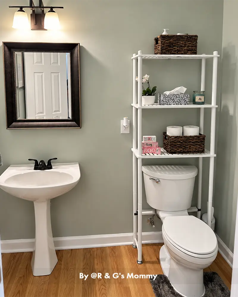 AmazerBath over-the-toilet bamboo organizer displayed in a customer bathroom with open shelves for toiletries and decor