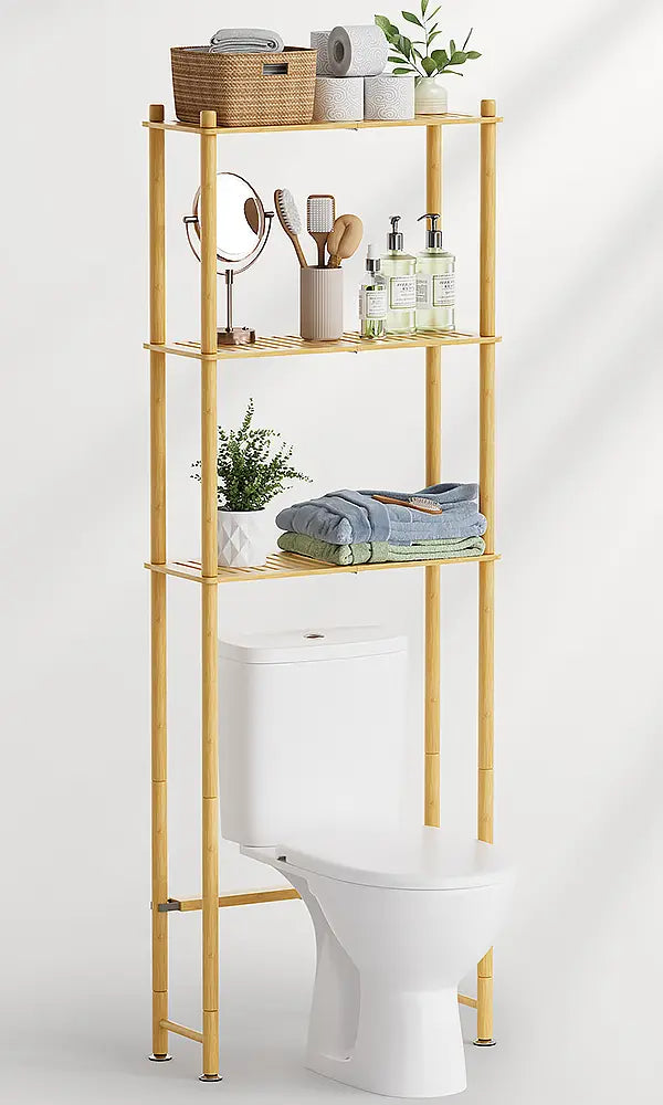 AmazerBath bamboo over-the-toilet storage rack displaying towels, toiletries, baskets, and plants