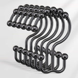 Set of black hooks with spherical ends on a white background