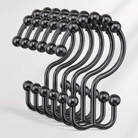 Set of black hooks with spherical ends on a white background