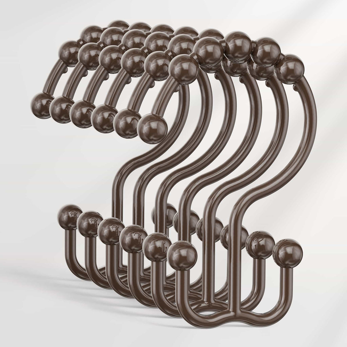 Set of bronze hooks on a white background