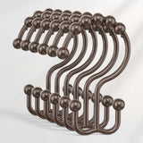 Set of bronze hooks on a white background