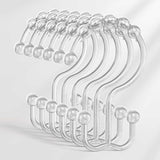 Set of clear plastic hooks on a light gray background