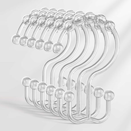 Set of clear plastic hooks on a light gray background