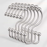 Set of metal hooks on a light gray background