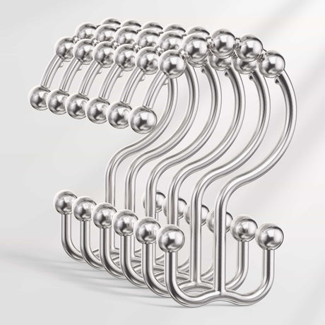 Set of metal hooks on a light gray background