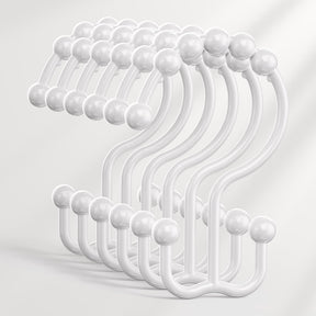 Set of white hooks on a light gray background