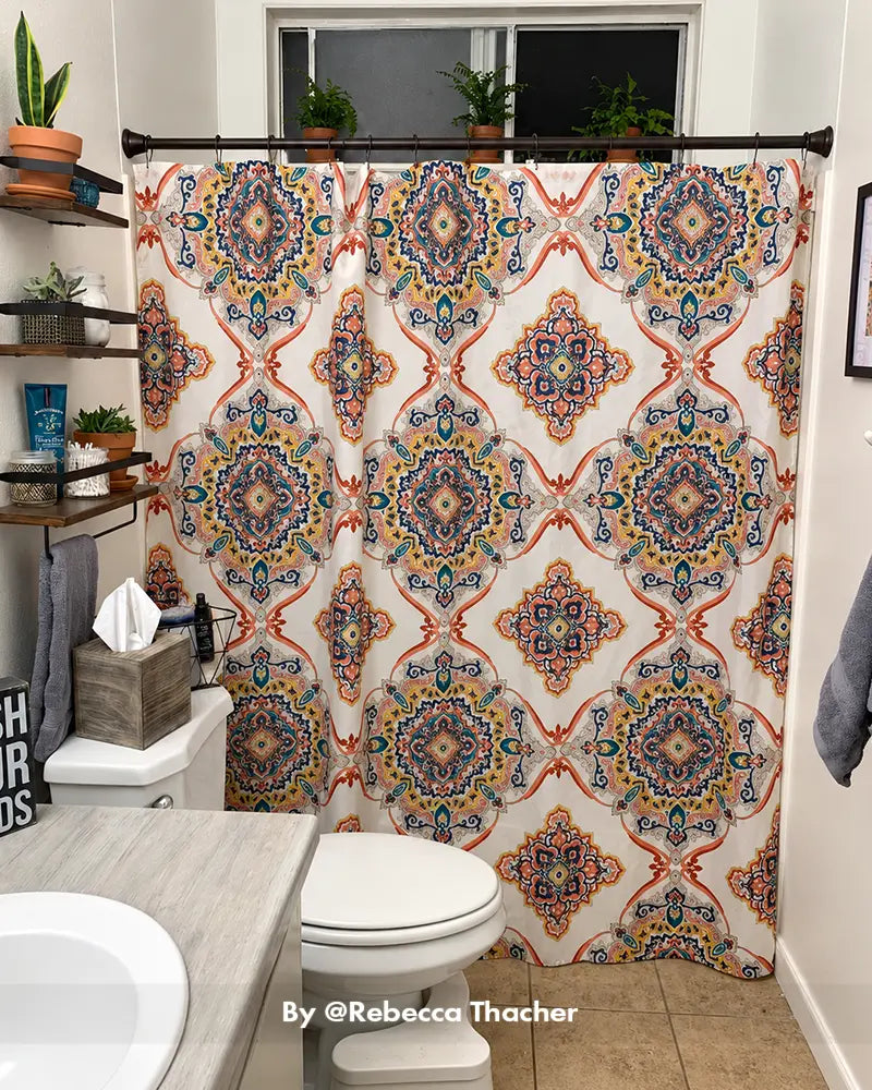 Customer bathroom photo showing a segmented shower curtain rod installed above a tub, with its joined sections visible.