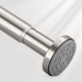 Close-up of a stainless steel shower rod with a textured end cap on a light gray background