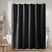 Black shower curtain in a bathroom setting with a bathtub and towel rack.