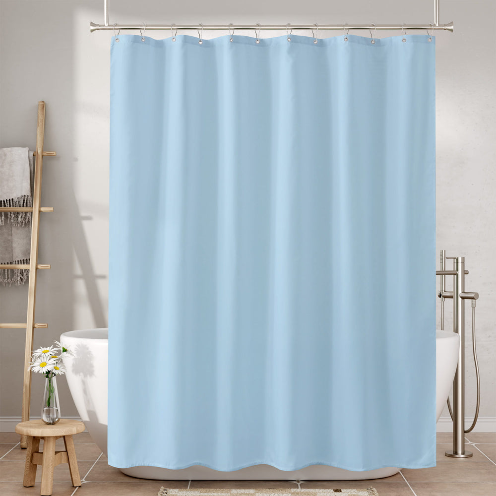 Light blue shower curtain in a bathroom setting with a bathtub and towel rack.