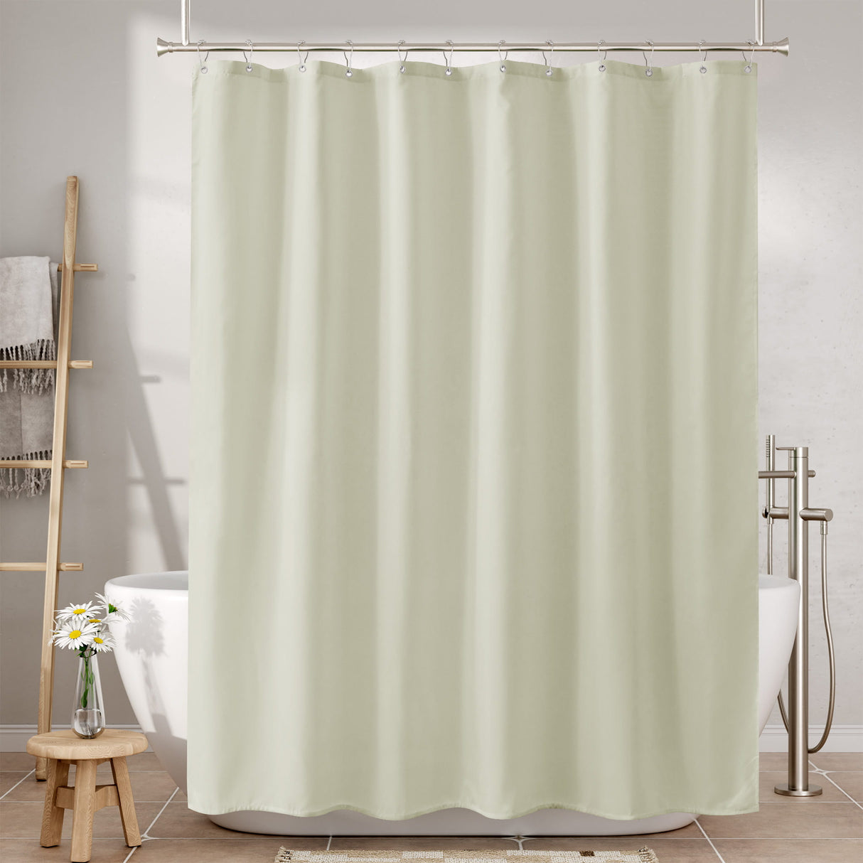 Beige shower curtain in a bathroom setting with bathtub and towel rack.