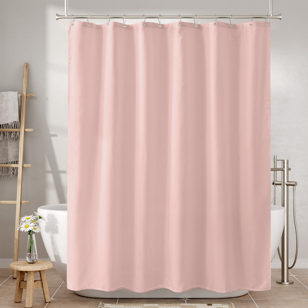 Pink shower curtain in a bathroom setting with bathtub and towel rack.