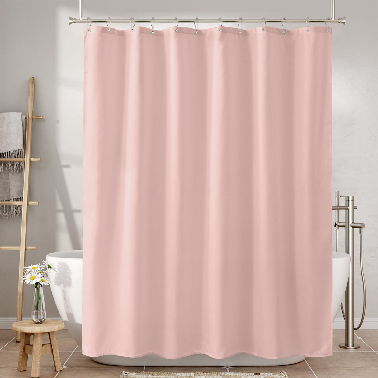 Pink shower curtain in a bathroom setting with bathtub and towel rack.