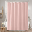 Pink shower curtain in a bathroom setting with bathtub and towel rack.