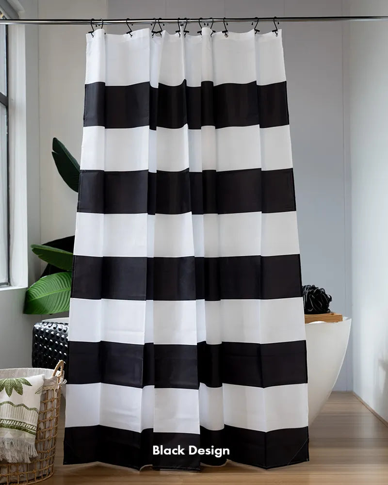 AmazerBath black and white striped shower curtain with 12 built-in rings hanging beside a modern white bathtub.