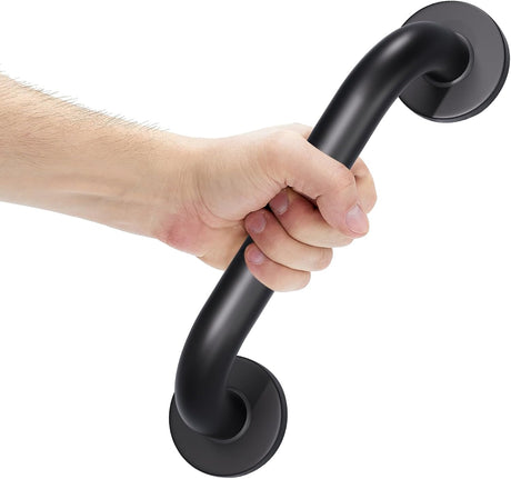 Hand holding a black grab bar against a white background