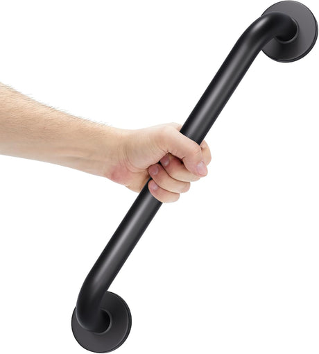 Hand holding a black grab bar against a white background