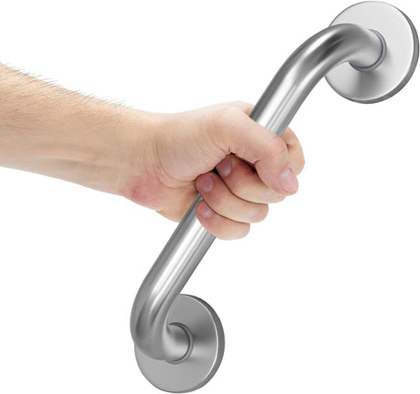 Hand holding a stainless steel grab bar against a white background