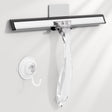 Clear squeegee with black handle on a white background