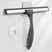 Window cleaning squeegee with a suction cup on a white background