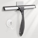Window cleaning squeegee with a suction cup on a white background