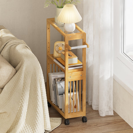 Bamboo rolling cart with books and a lamp in a room setting