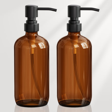 Two brown bottles with black pumps on a white background