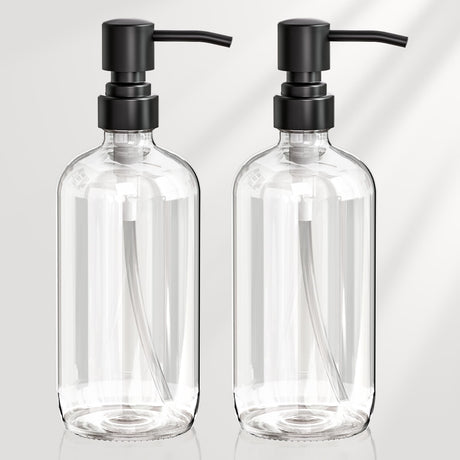 Two clear glass bottles with black pumps on a light gray background