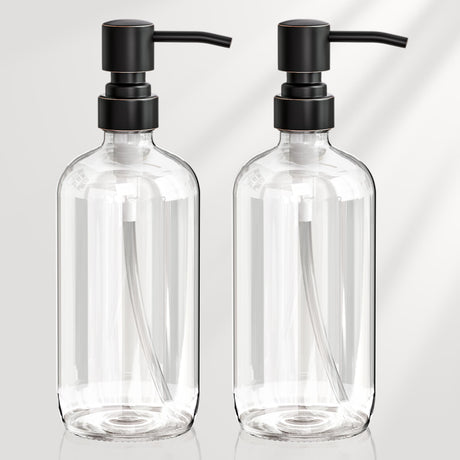 Two clear glass bottles with black pumps on a light gray background
