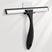 Black squeegee with a silver blade on a white background