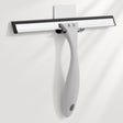 Squeegee with black rubber blade and silver metal handle on a white background