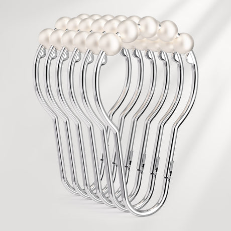Set of clear plastic hangers with white pearls on a light gray background