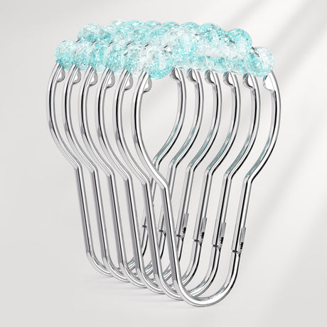 Set of metal hangers with a blue decorative top on a light gray background