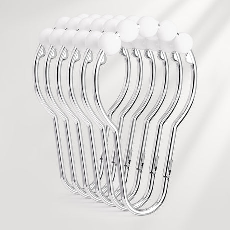 Set of clear plastic hangers on a light gray background