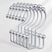 Set of metal hangers with spherical ends on a white background