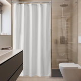 White shower curtain in a modern bathroom setting