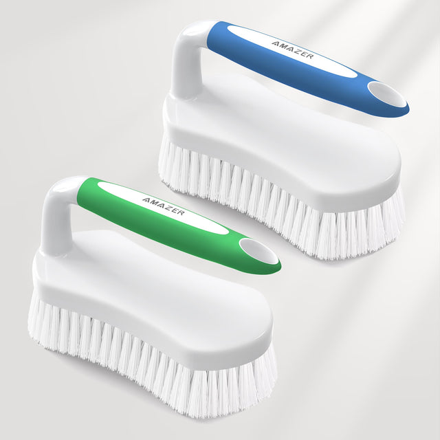 Two cleaning brushes with white bristles and colored handles on a light gray background.