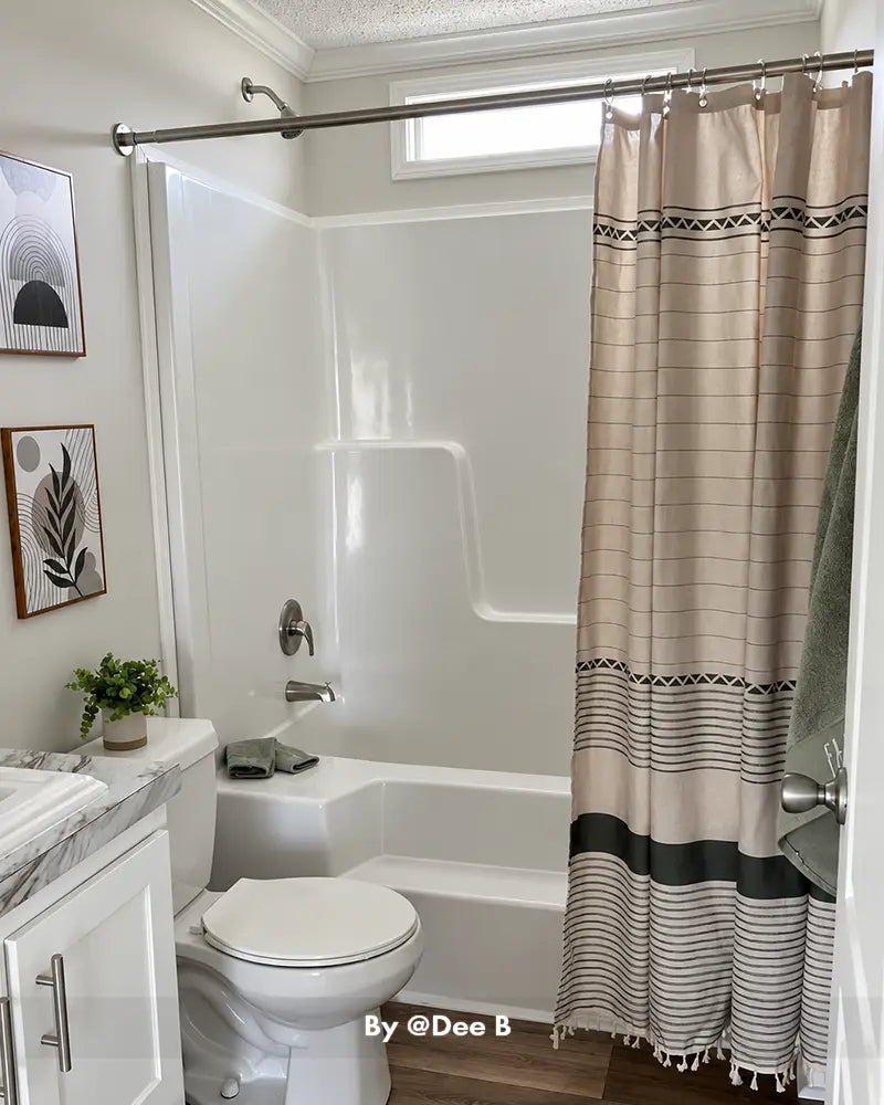 AmazerBath striped boho shower curtain displayed in a real bathroom, adding textured lines and a relaxed neutral accent