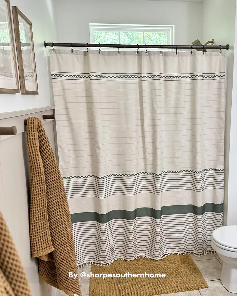 AmazerBath striped bohemian shower curtain hanging in a customer bathroom, adding subtle texture around the bathtub
